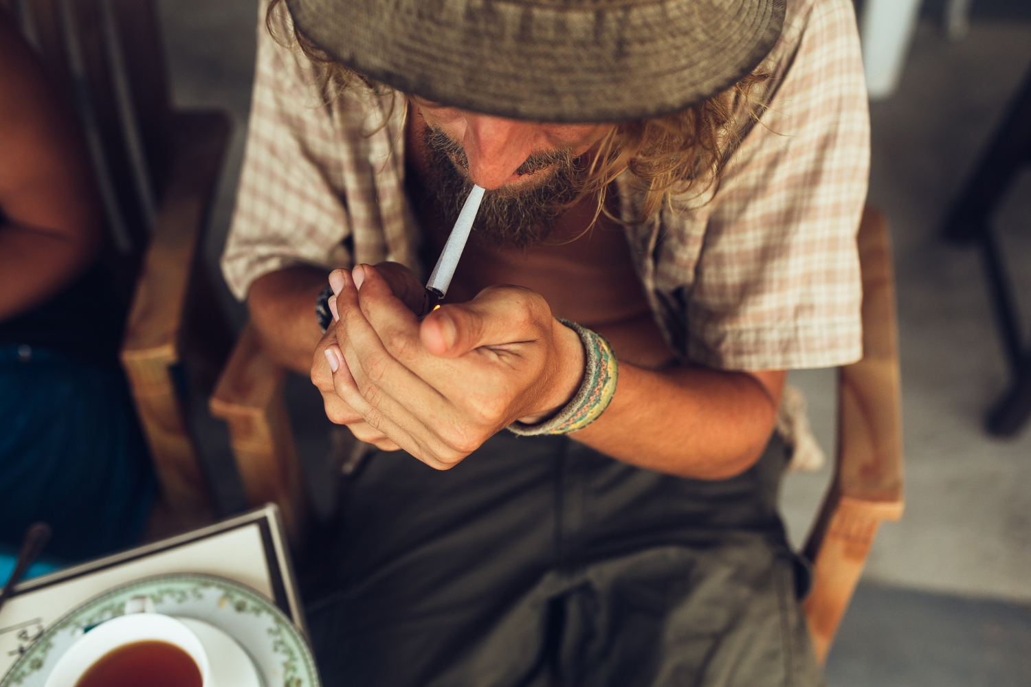 a man lights a cigarette